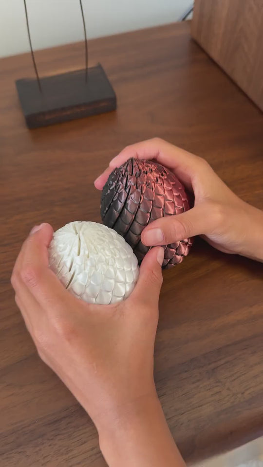 Dragon Egg fidget toys unfolding in rose copper and pearl white, video demo